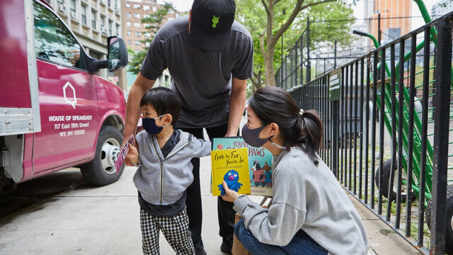 Dad, mom, and toddler with picture books