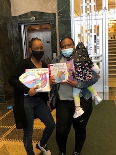 two women holding books