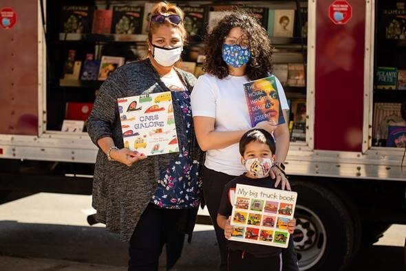 Families visiting the House of SpeakEasy Bookmobile